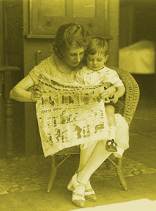 Musical_comedy_star_Dorothy_Brunton_reading_Sid_Nicholl's_Fashion-plate_Fanny_in_the_children's_section_of_The_Sun_newspaper_with_a_small_boy_at_St._Margaret's_Hospital,_Sydney,_January_1925_-_Sam_(3467097987)